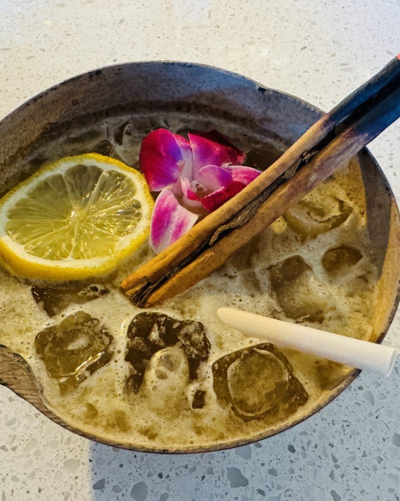 Ash & Clove — Mezcal, charred pineapple, and a clove-studded orange set alight tableside — our smokiest pour, by a wide margin.