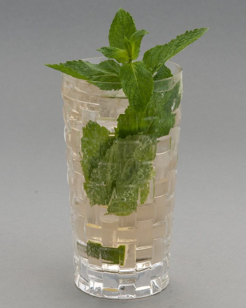 Garden Absence — Our zero-proof pour, built with the same care as anything with alcohol in it — cucumber, mint, and a shrub we make in-house.